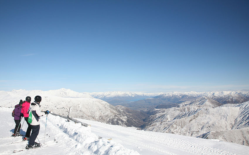 Skiers looking down from the Cardrona Ski Field near Wanaka, in